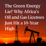 Silhouettes of an oil rig and pumpjack set against a dramatic red-orange sunset sky, symbolizing Africa’s rising fossil fuel activity amidst global climate discussions.